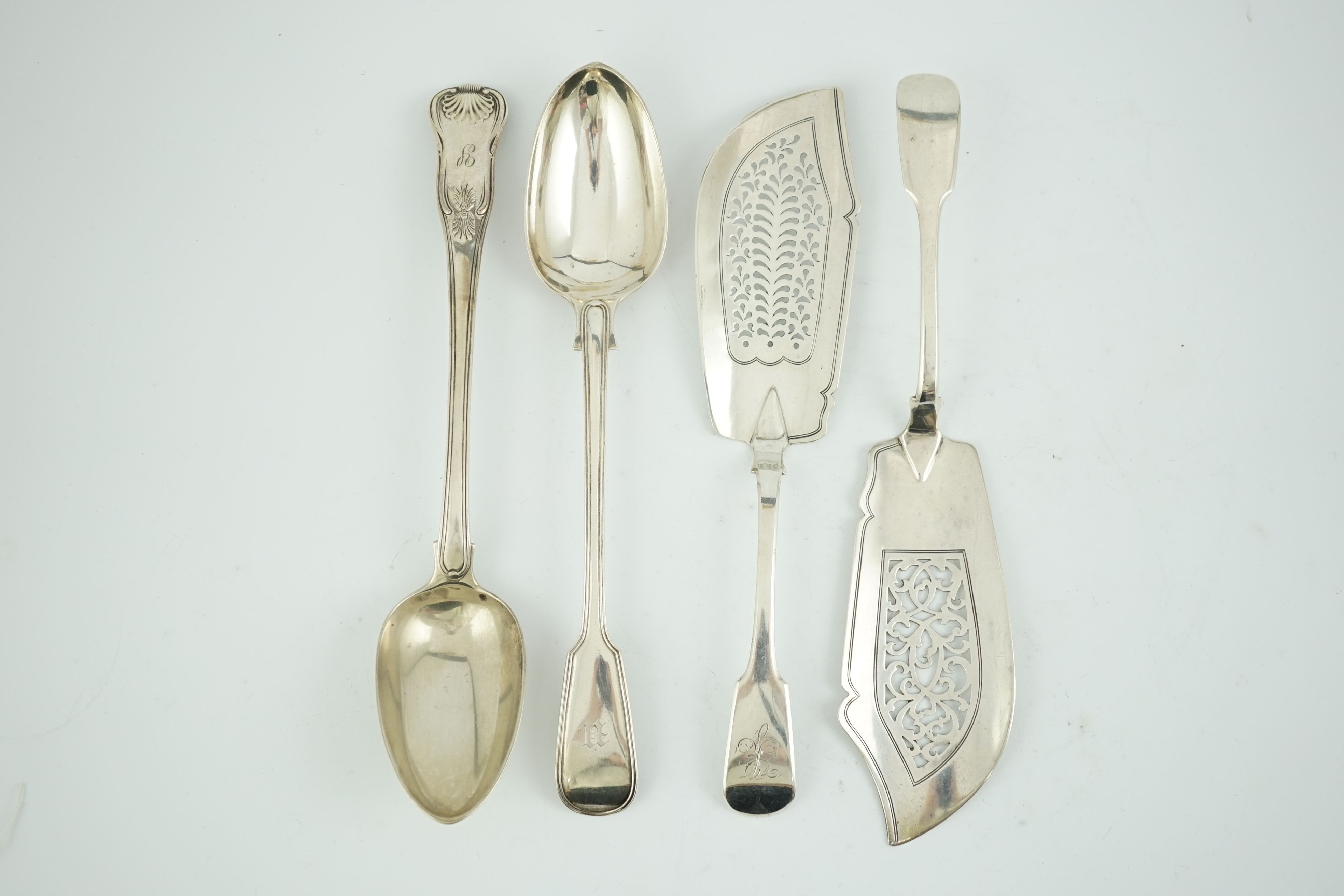 Two early 19th century silver fish slices, Charles Boyton, London, 1831 and Joseph & Albert Savory, London, 1846, largest 31.2cm, together with two 19th century silver basting spoons, William Chawner, London, 1816 and Ge